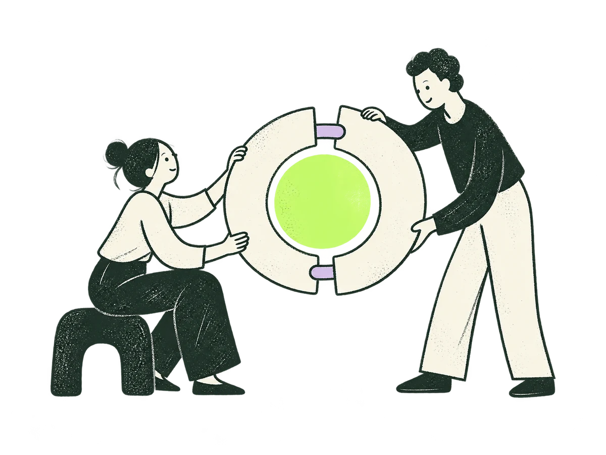 Two people bring complementary pieces together around a shared focus.